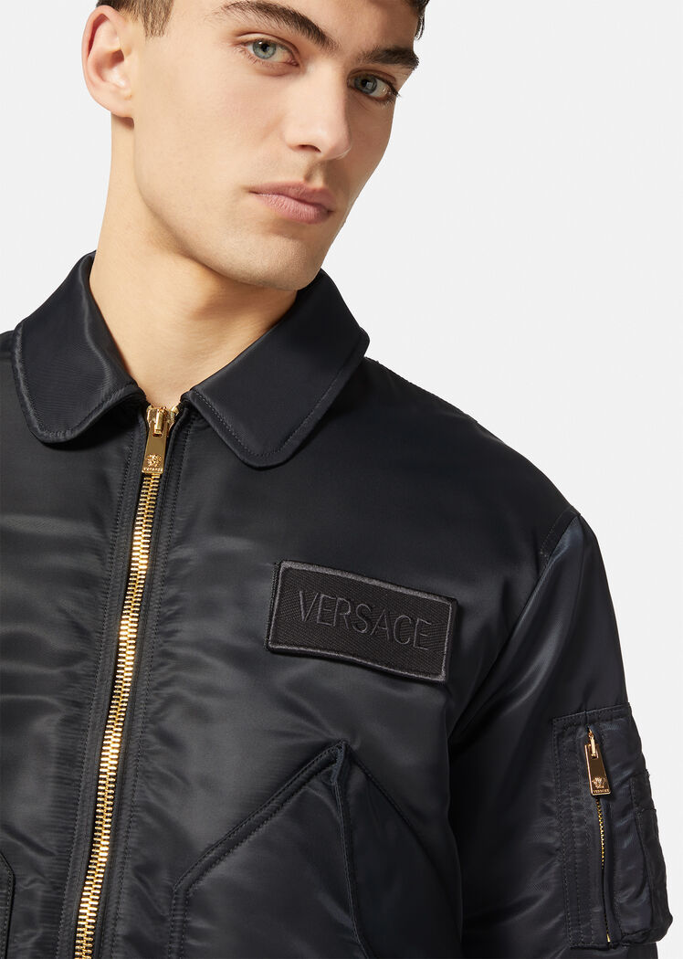 Versace Quilted Zip-up Bomber Jacket With Logo Patch In Black
