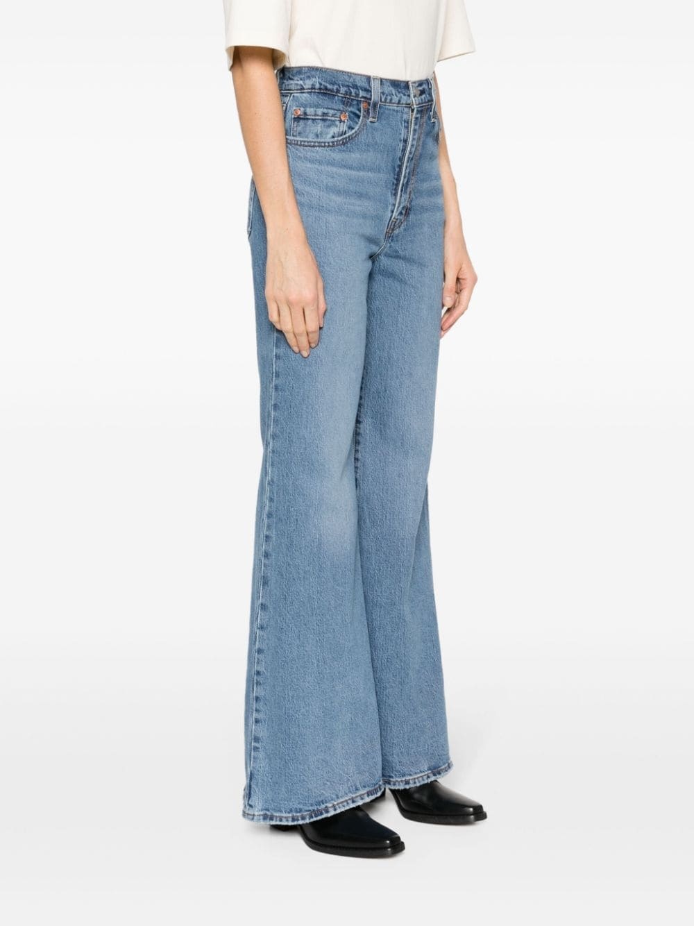 Shop Levi's Mid-rise Flared Jeans In Blue
