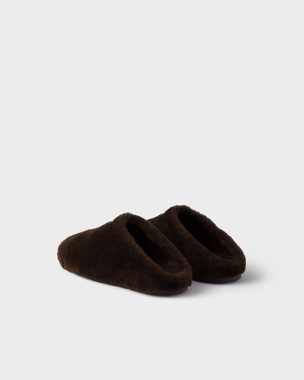 Prada Shearling Mules In Brown