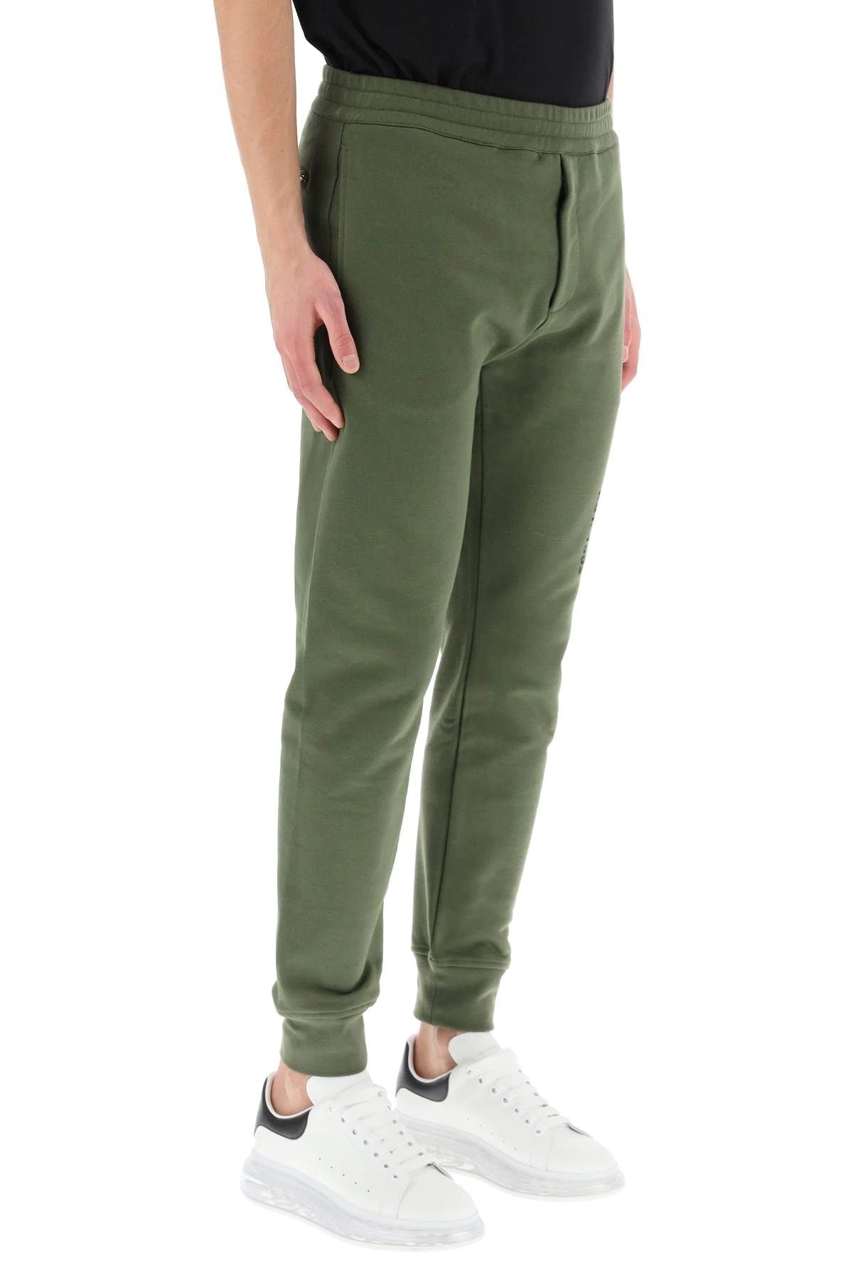Alexander Mcqueen Logo Print Tapered Track Trousers In Green