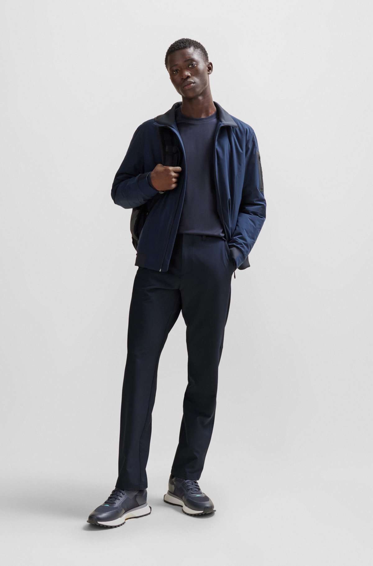 Hugo Boss Water-repellent Tapered Trousers In Black