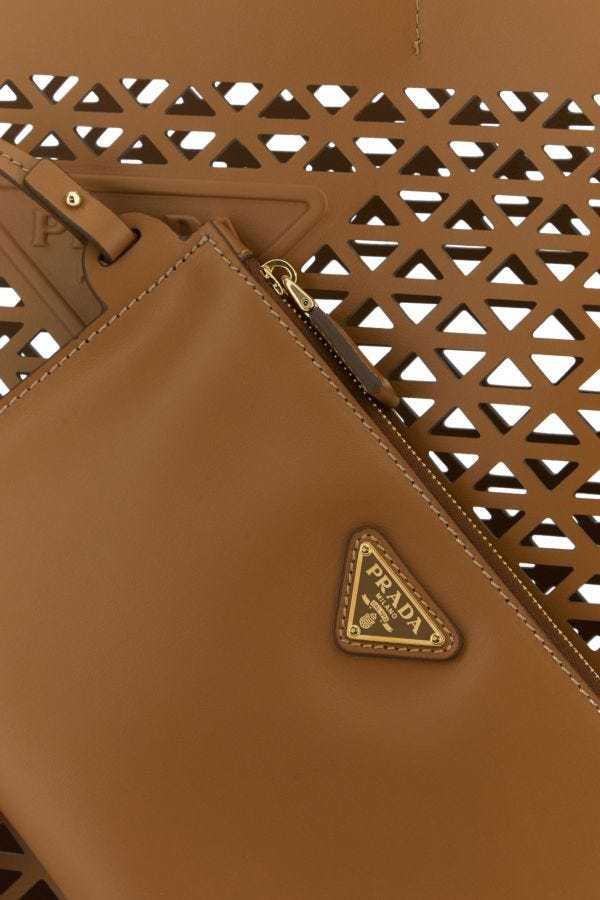 Prada Leather Shopping Bag Featuring Cut-out Detailing In Brown