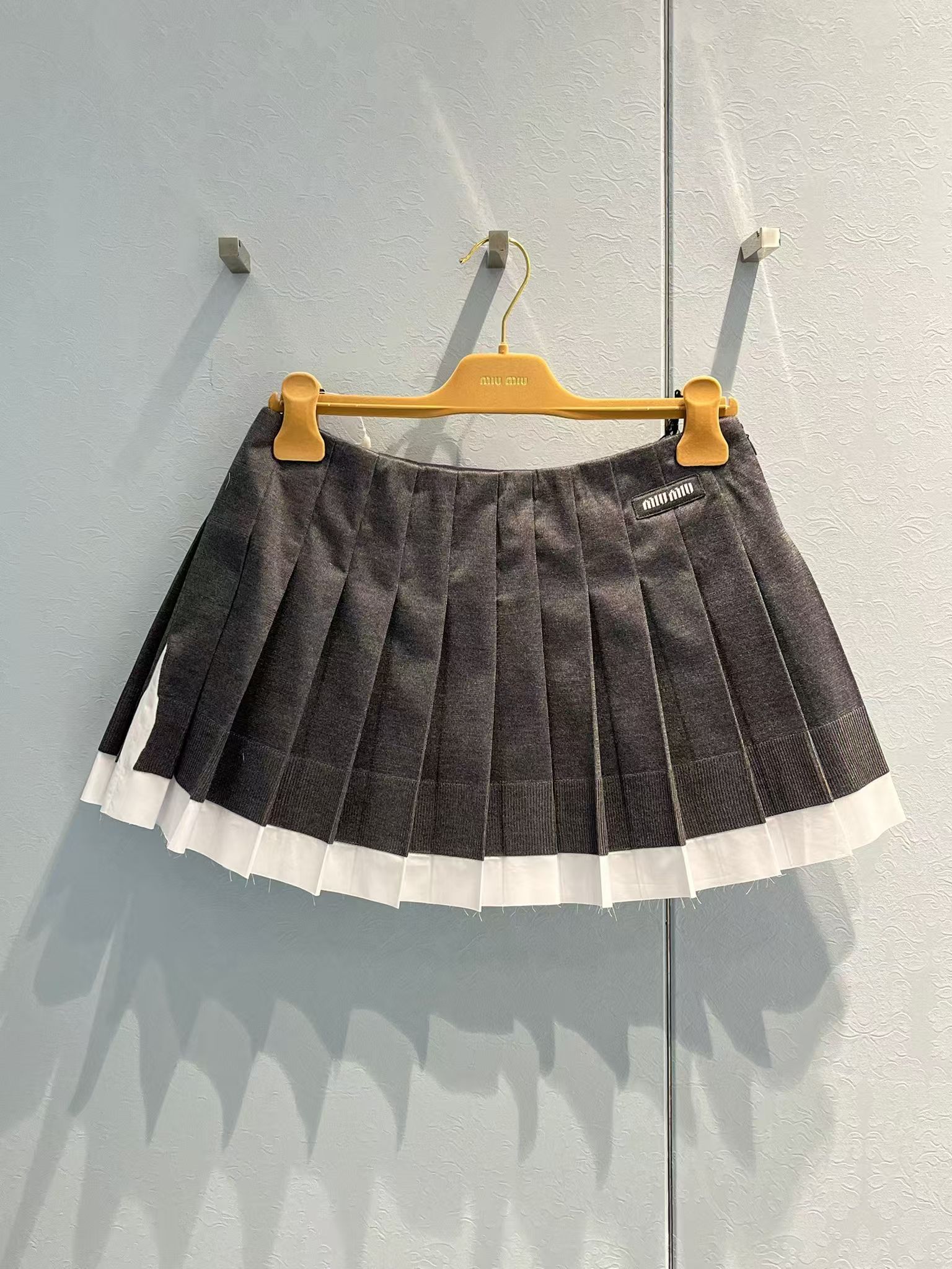 MIU MIU KNIT AND POPLIN PLEATED MINISKIRT