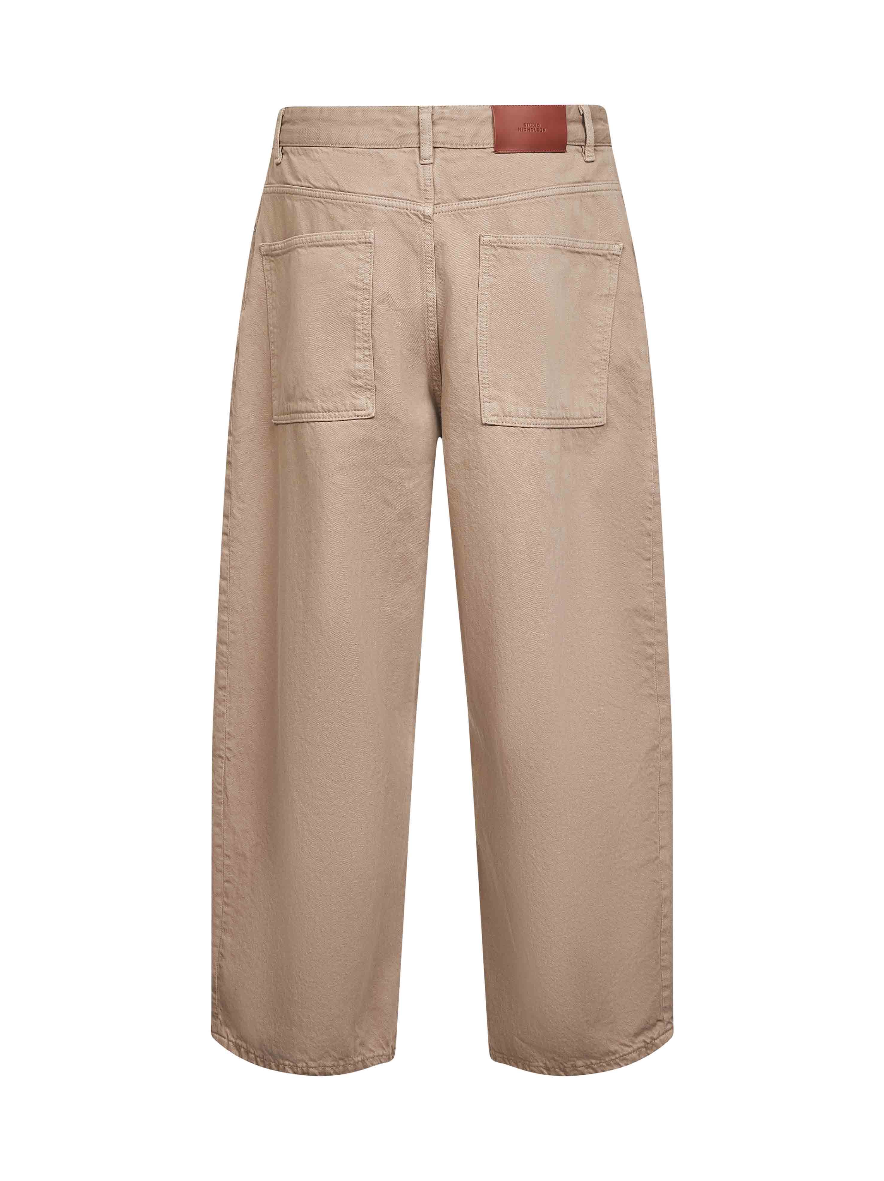 Studio Nicholson Logo Denim Trousers In Brown
