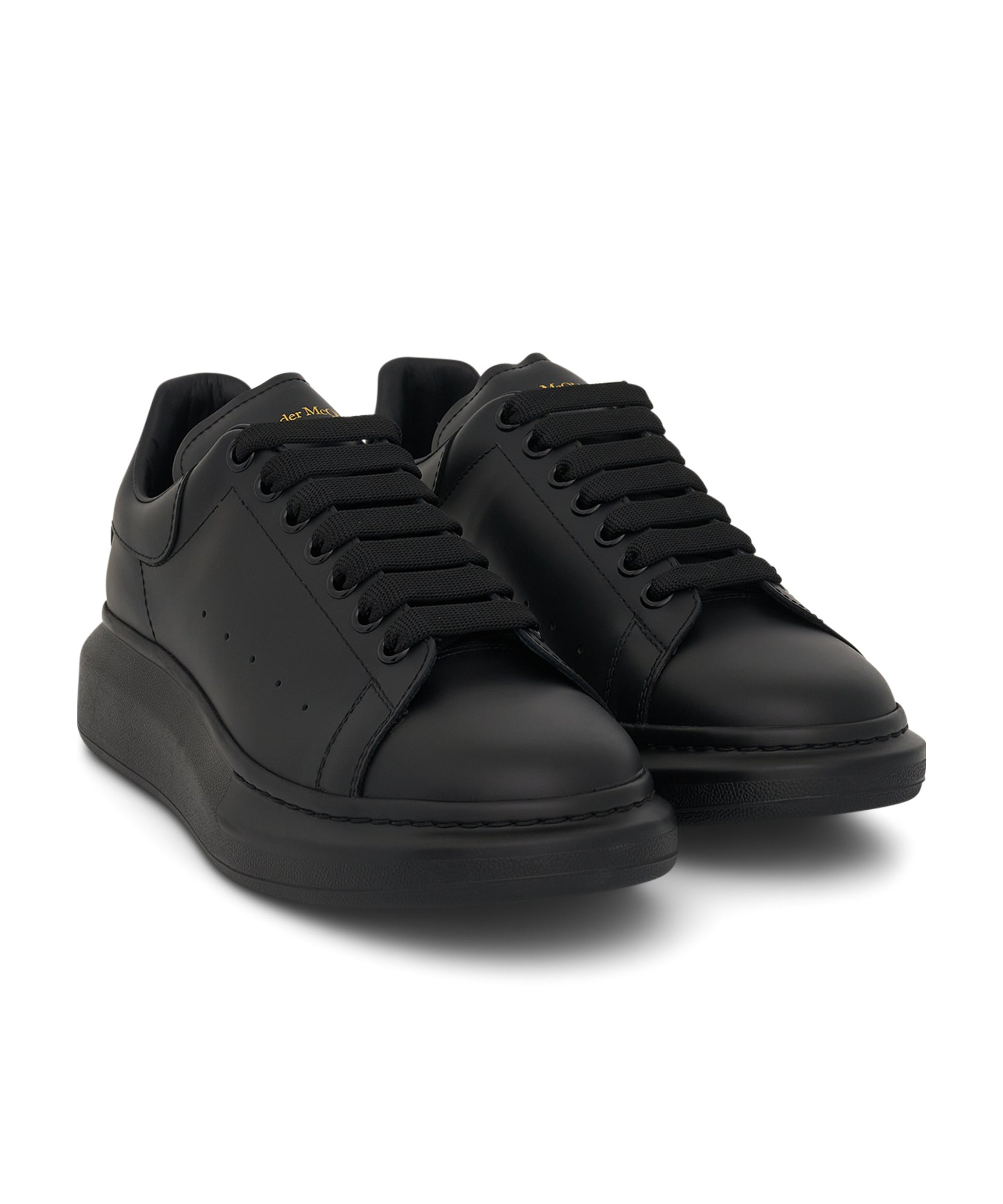 Alexander Mcqueen Black Sneakers With Logo Lettering On The Rear And Oversize Rubber Sole In Leather In Black