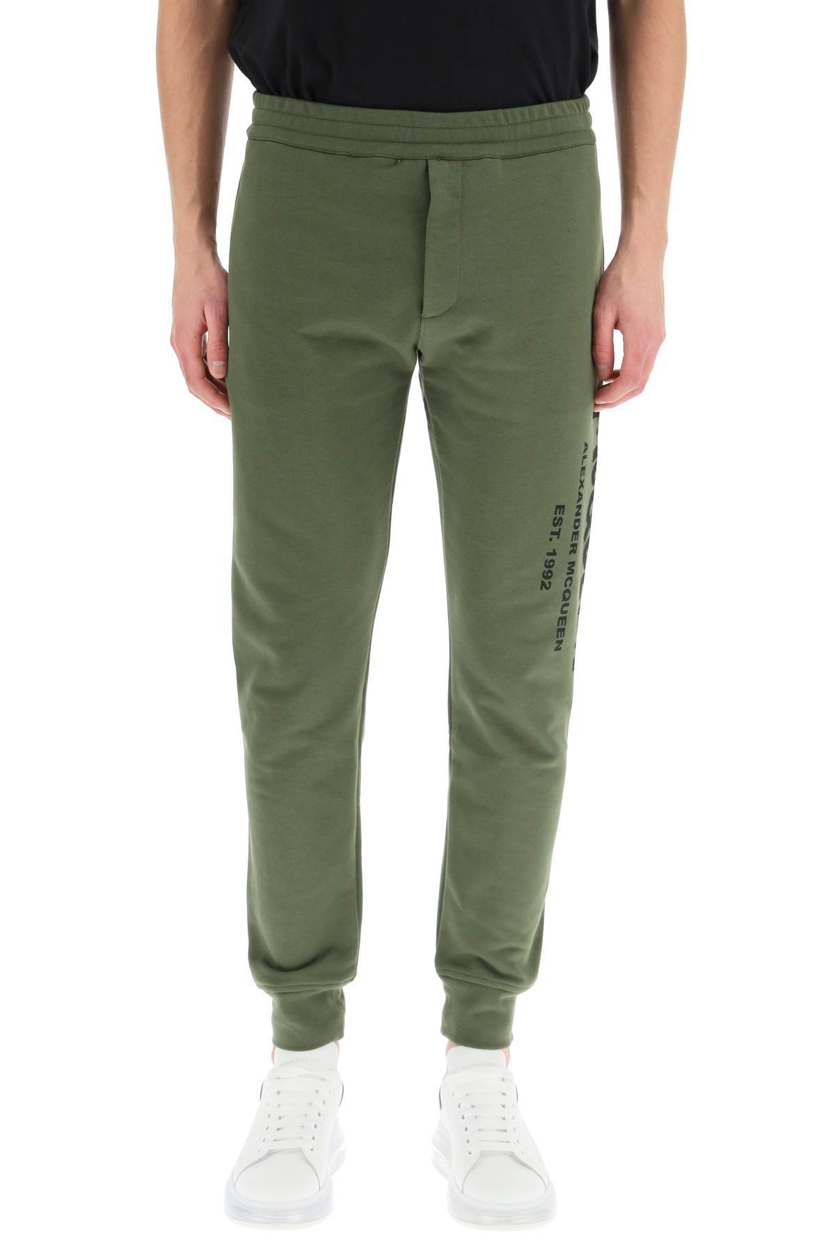 Alexander Mcqueen Logo Print Tapered Track Trousers In Green