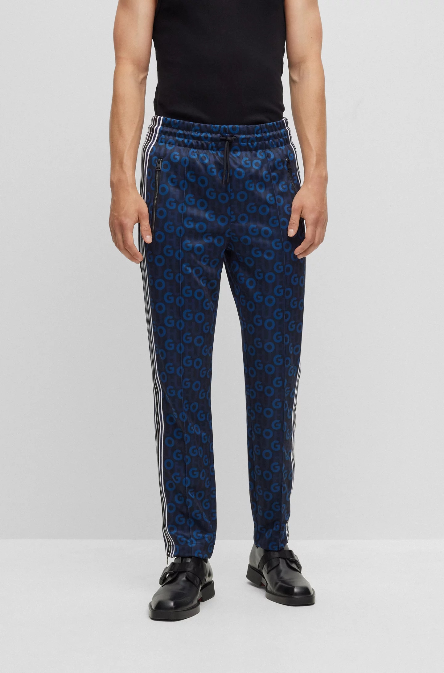 Hugo Boss Monogram-print Side-stripe Track Pants In Black