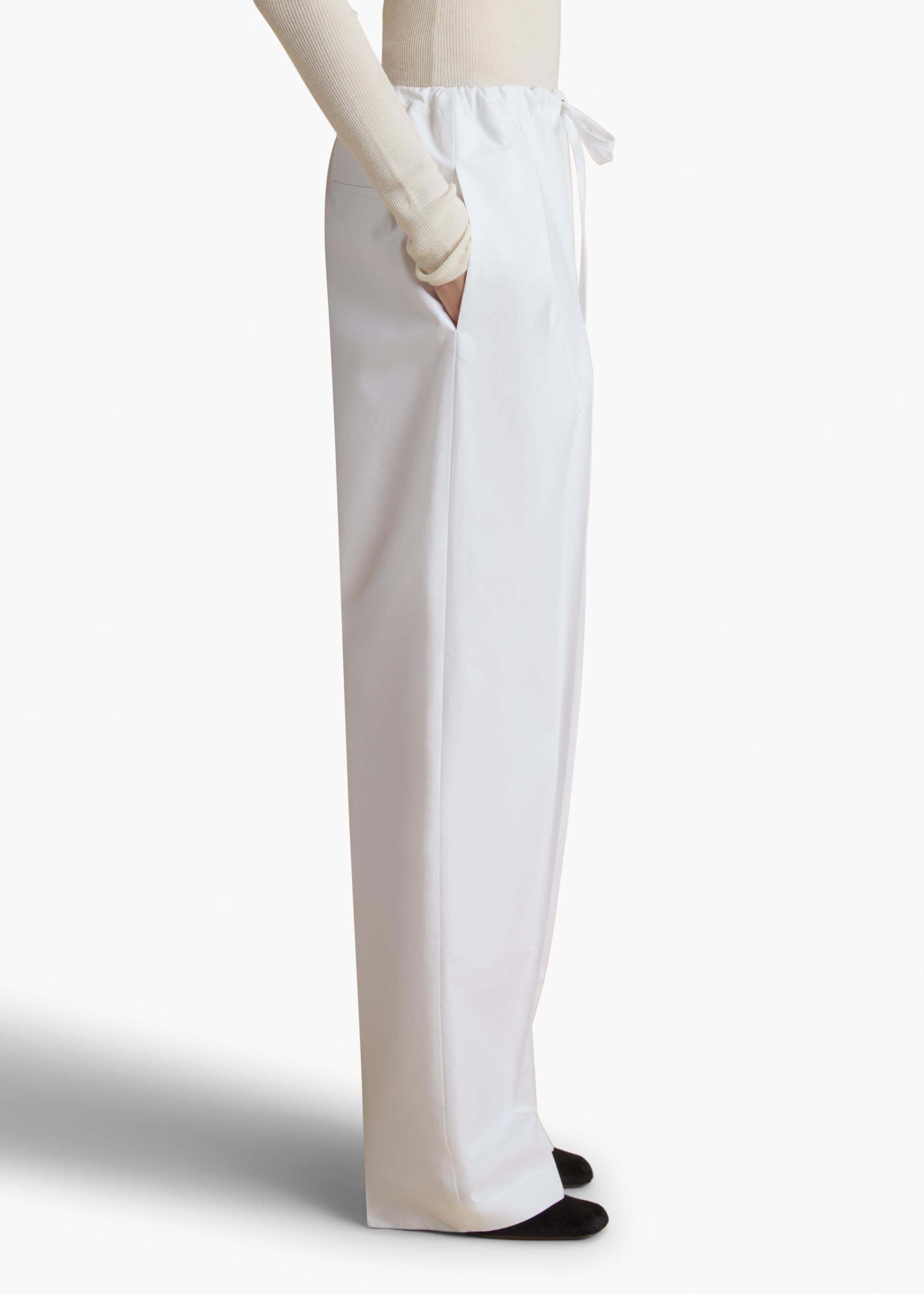 Shop Khaite Pressed Crease Drawstring Trousers In White