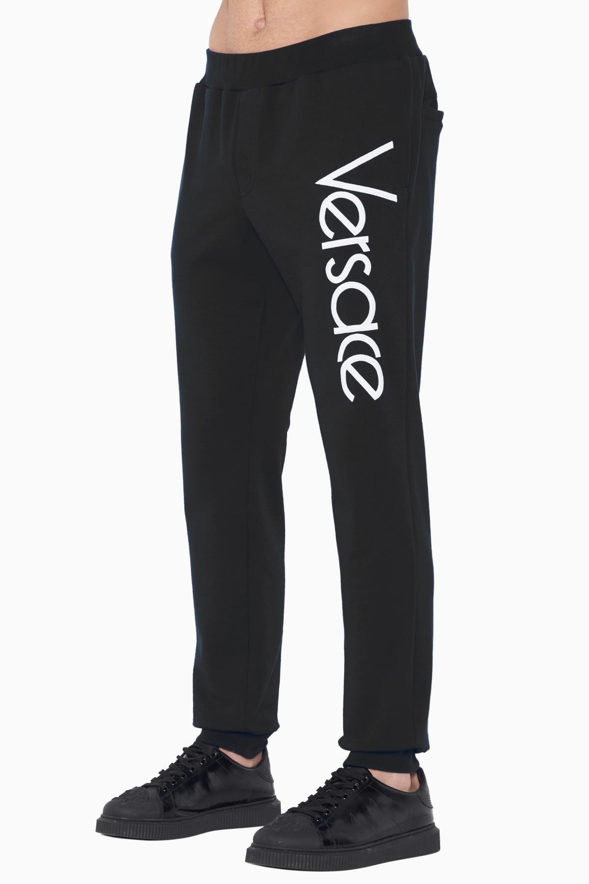 Versace Logo Sports Leg Retractor Pants In Black