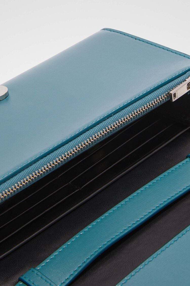 Jil Sander All-day Logo Embossed Small Crossbody Bag In Blue