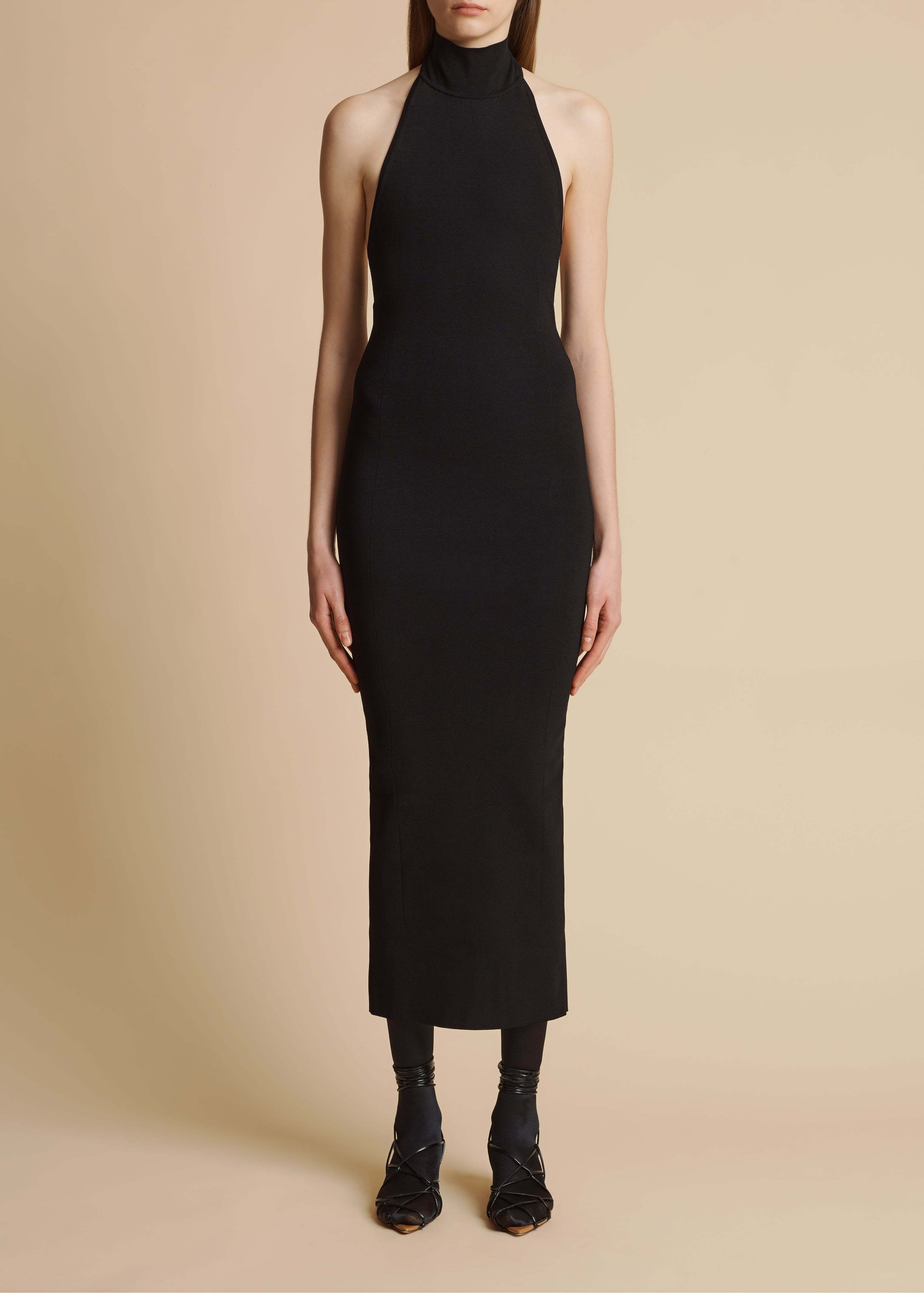 Shop Khaite The Suzanne Ribbed Midi Dress In Black