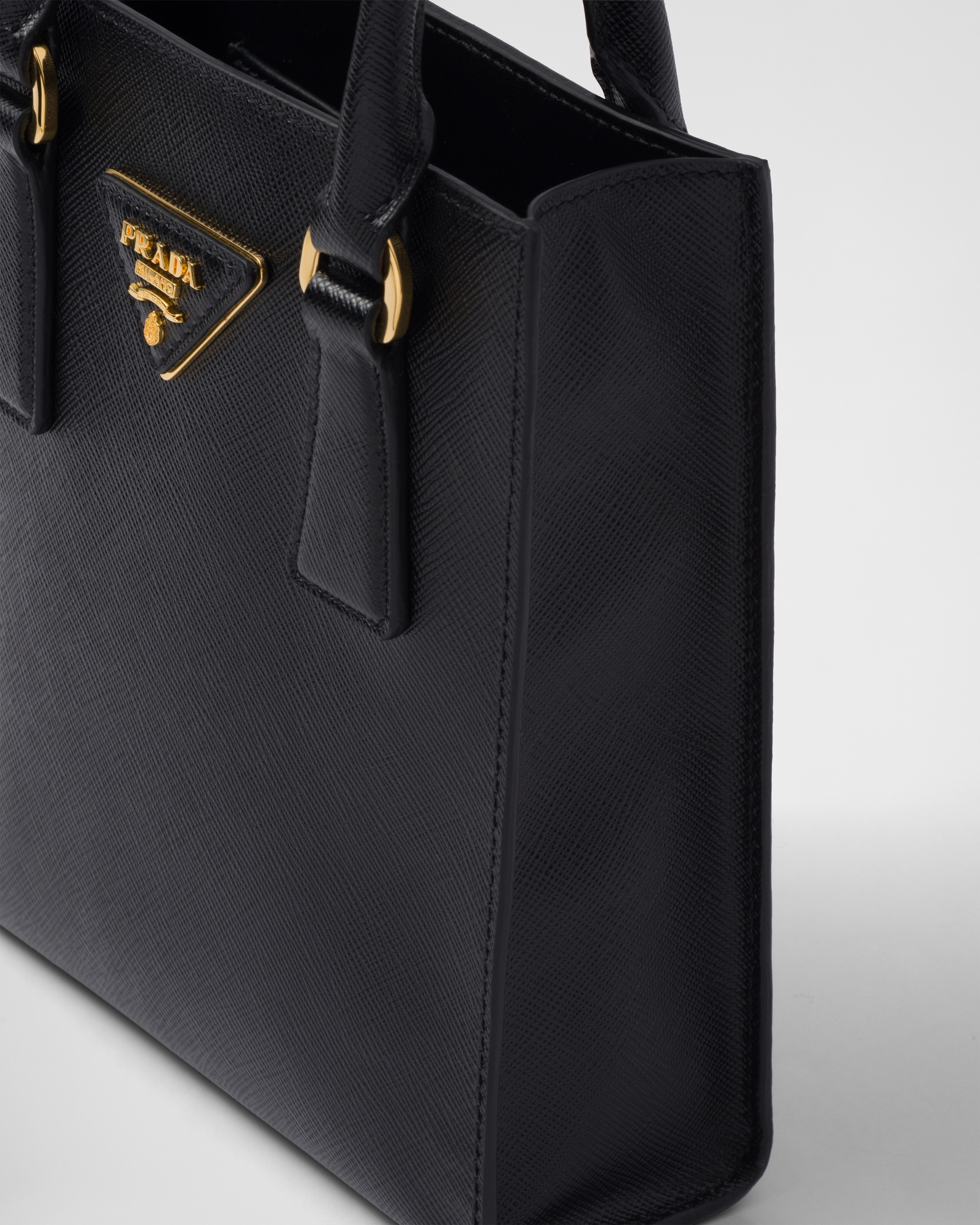 Shop Prada Saffiano Leather Handbag In Black