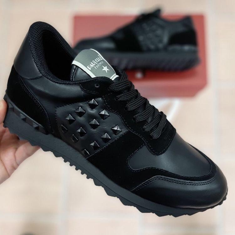 Shop Valentino Rockstud Low-top Sneakers In Black