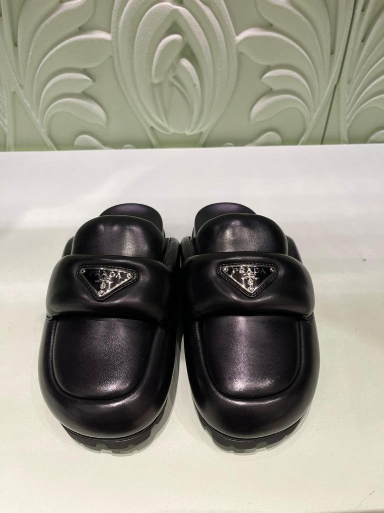 Prada Padded Leather Sabots In Black