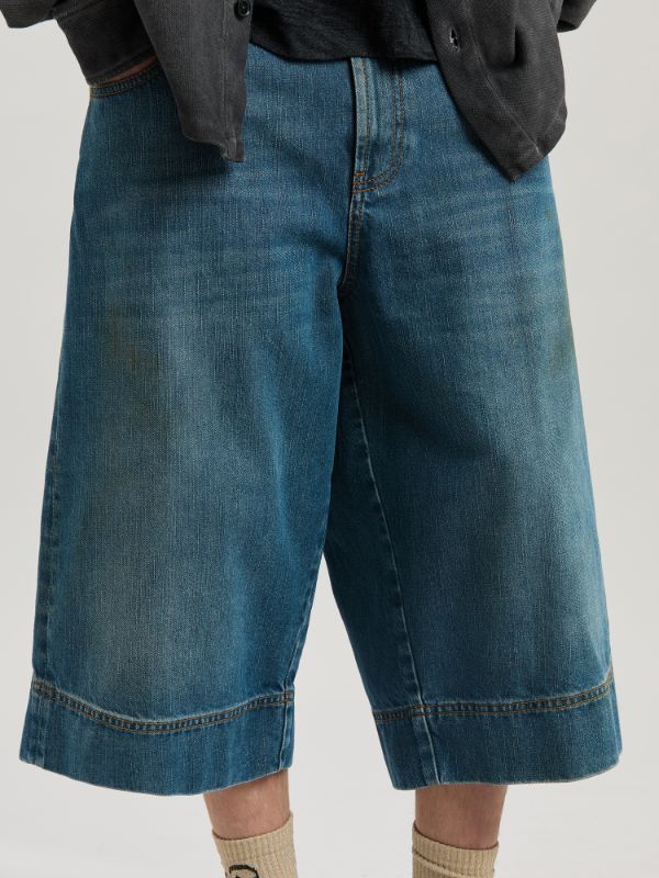 Palm Angels Lasered Curved Logo Denim Skater Bermuda In Blue