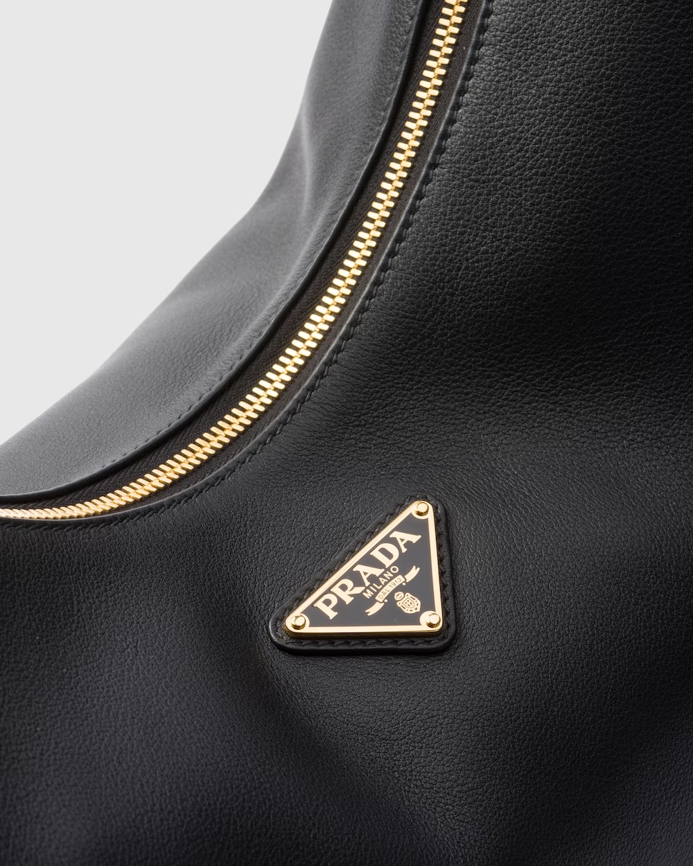 Prada Rounded Shoulder Bag With Gold-tone Hardware In Black