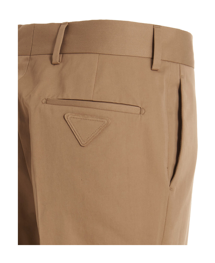 Prada Rear Logo-patch Detail Trousers In Brown