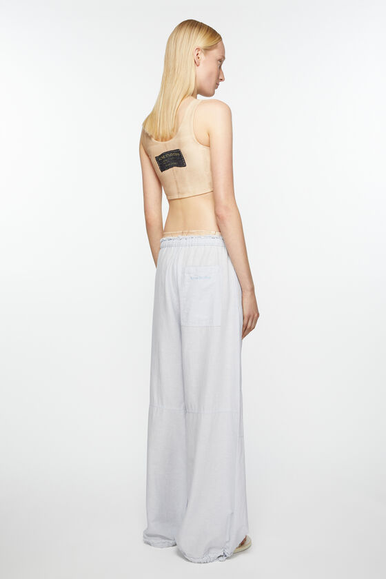 Shop Acne Studios Embroidered-logo Wide-leg Trousers In Blue