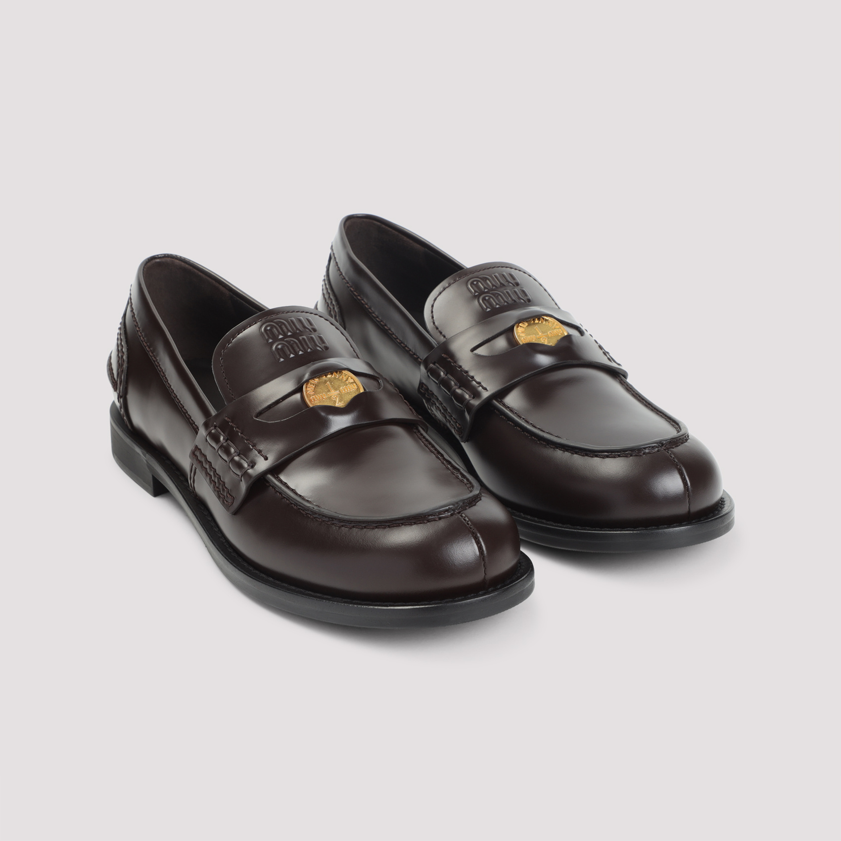 Miu Miu Logo Embossed Leather Loafers In Black