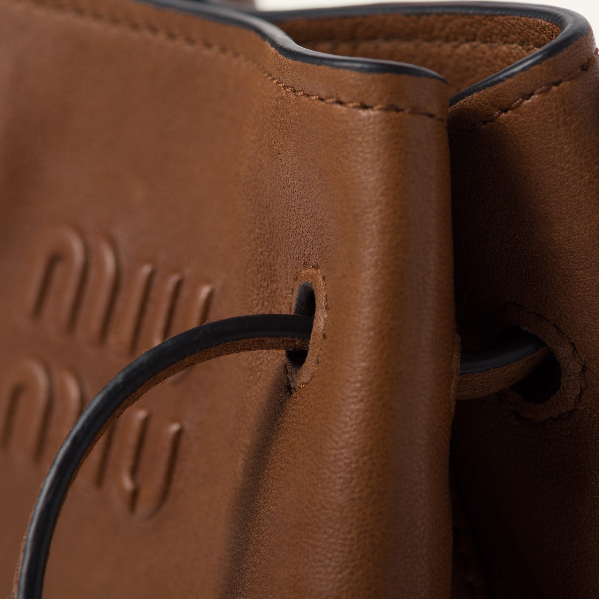 Miu Miu Mini Logo-embossed Bucket Bag In Brown
