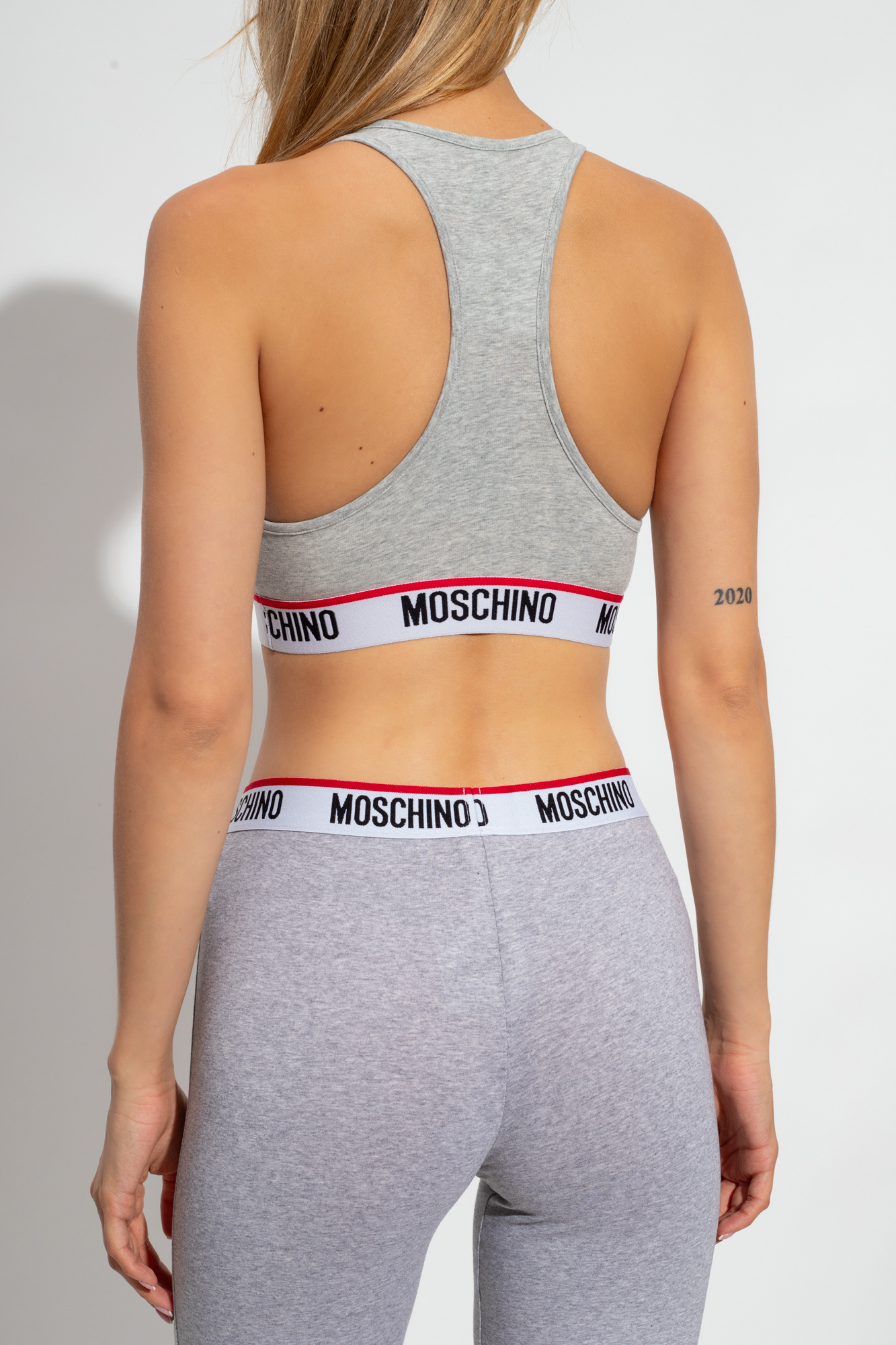 Shop Moschino Logo Underband Sports Bra In Gray