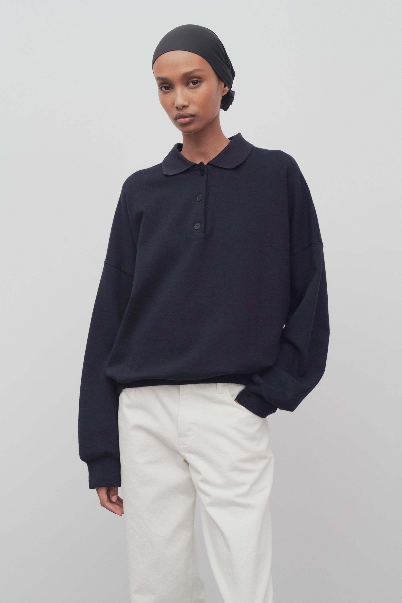 The Row Long-sleeved Polo Jumper In Black