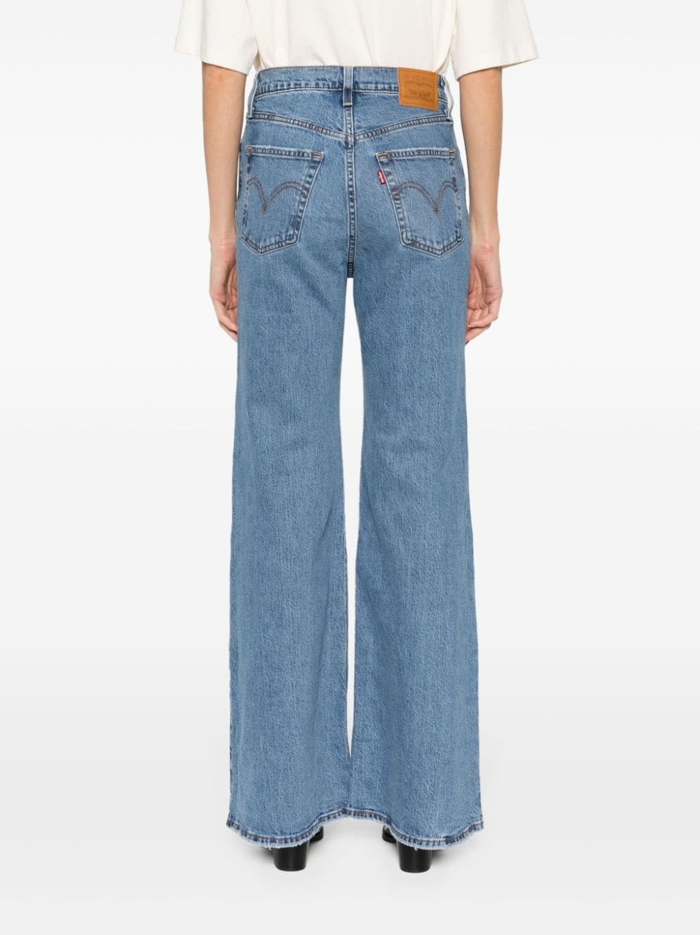 Shop Levi's Mid-rise Flared Jeans In Blue