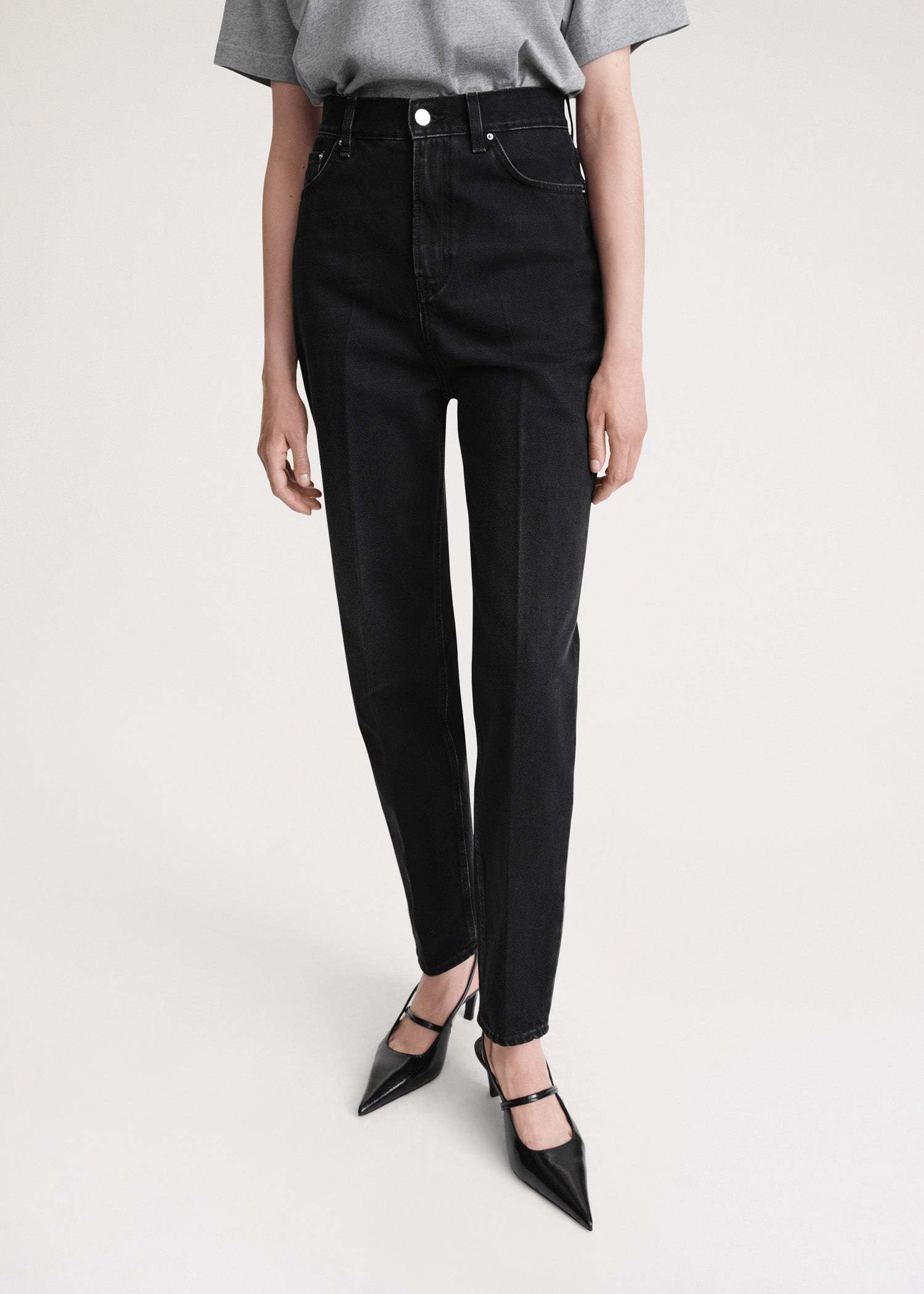 Totême Faded-effect Tapered-leg Jeans In Black