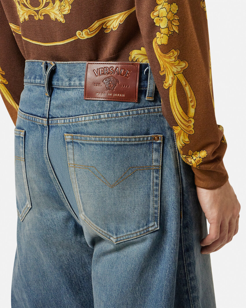 Versace Baggy Twisted Japanese Jeans In Blue