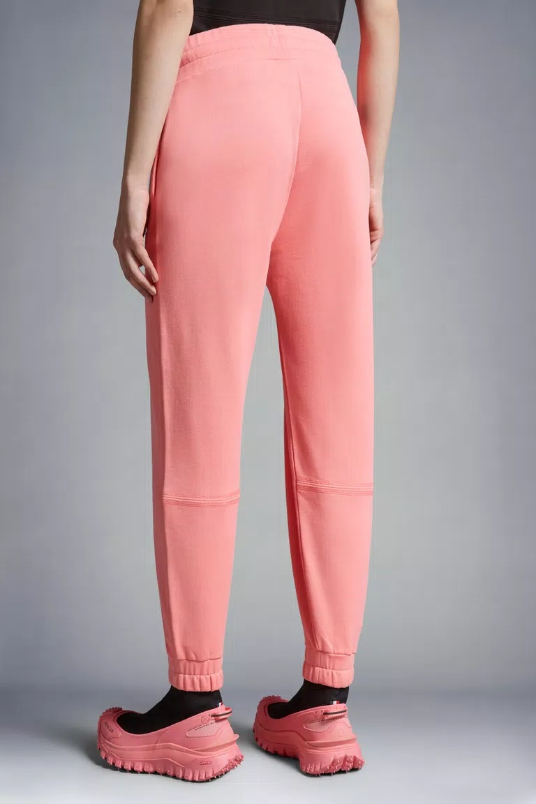 Shop Moncler Embossed Logo Trackpants In Pink