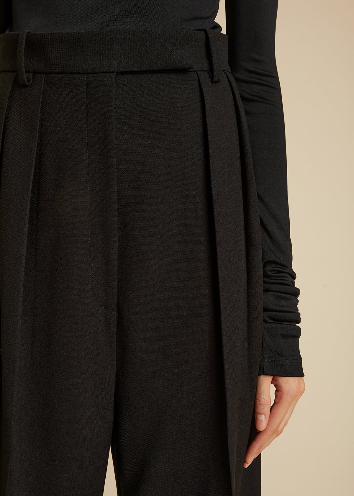 Khaite Cessie Pleated High-waisted Trousers In Black