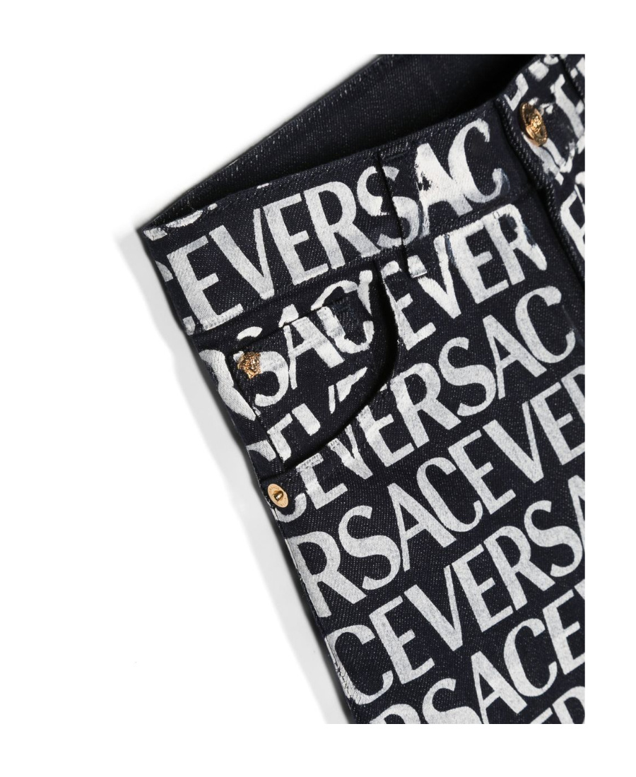 Versace Metallic Logo Print Jeans In Black