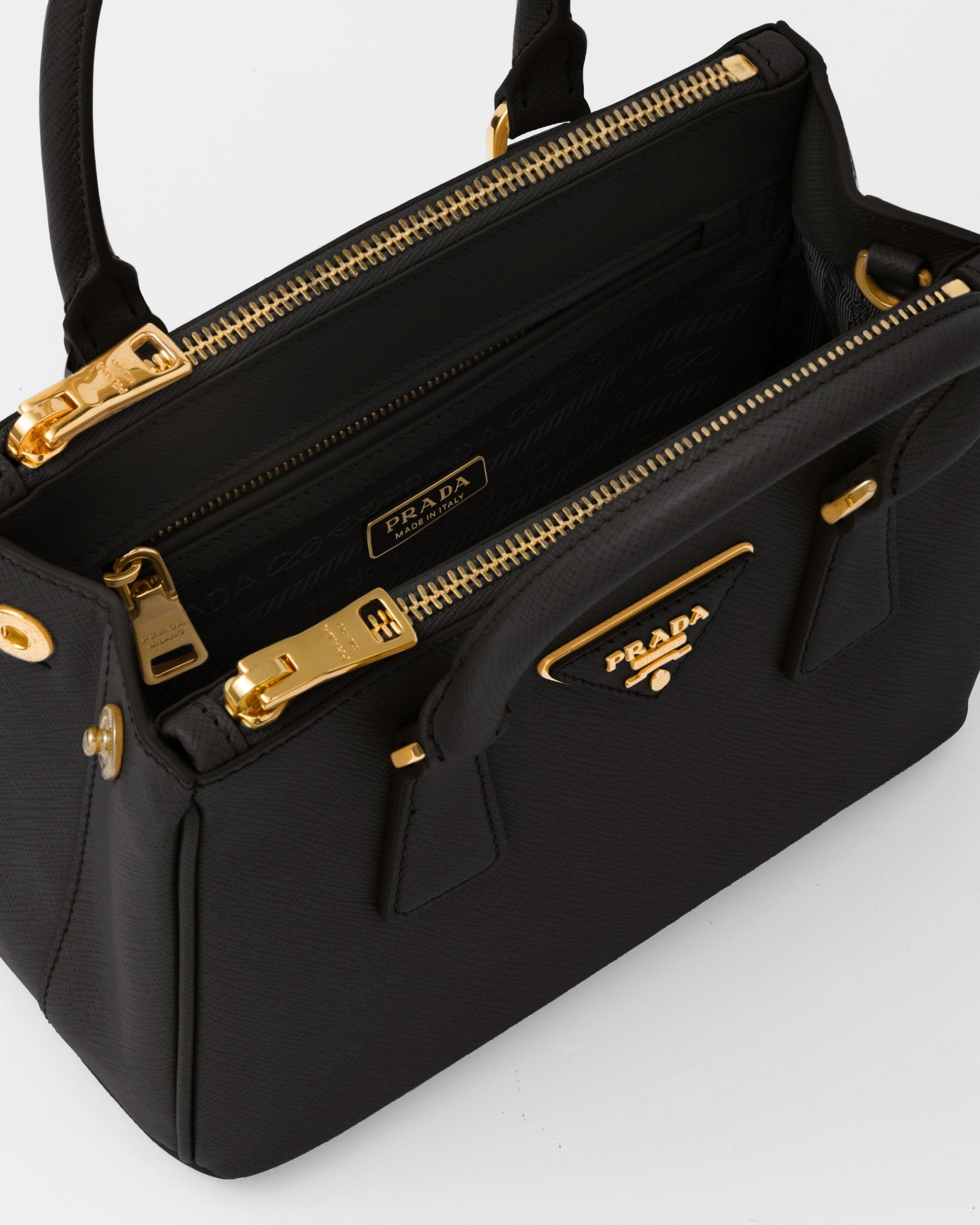 Prada Galleria Saffiano Leather Mini Logo Handbag In Black