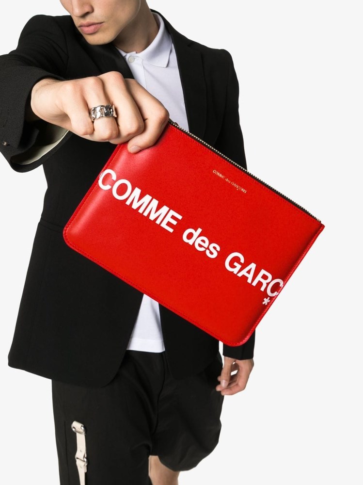 COMME DES GARÇONS LOGO-PRINT LEATHER CLUTCH BAG