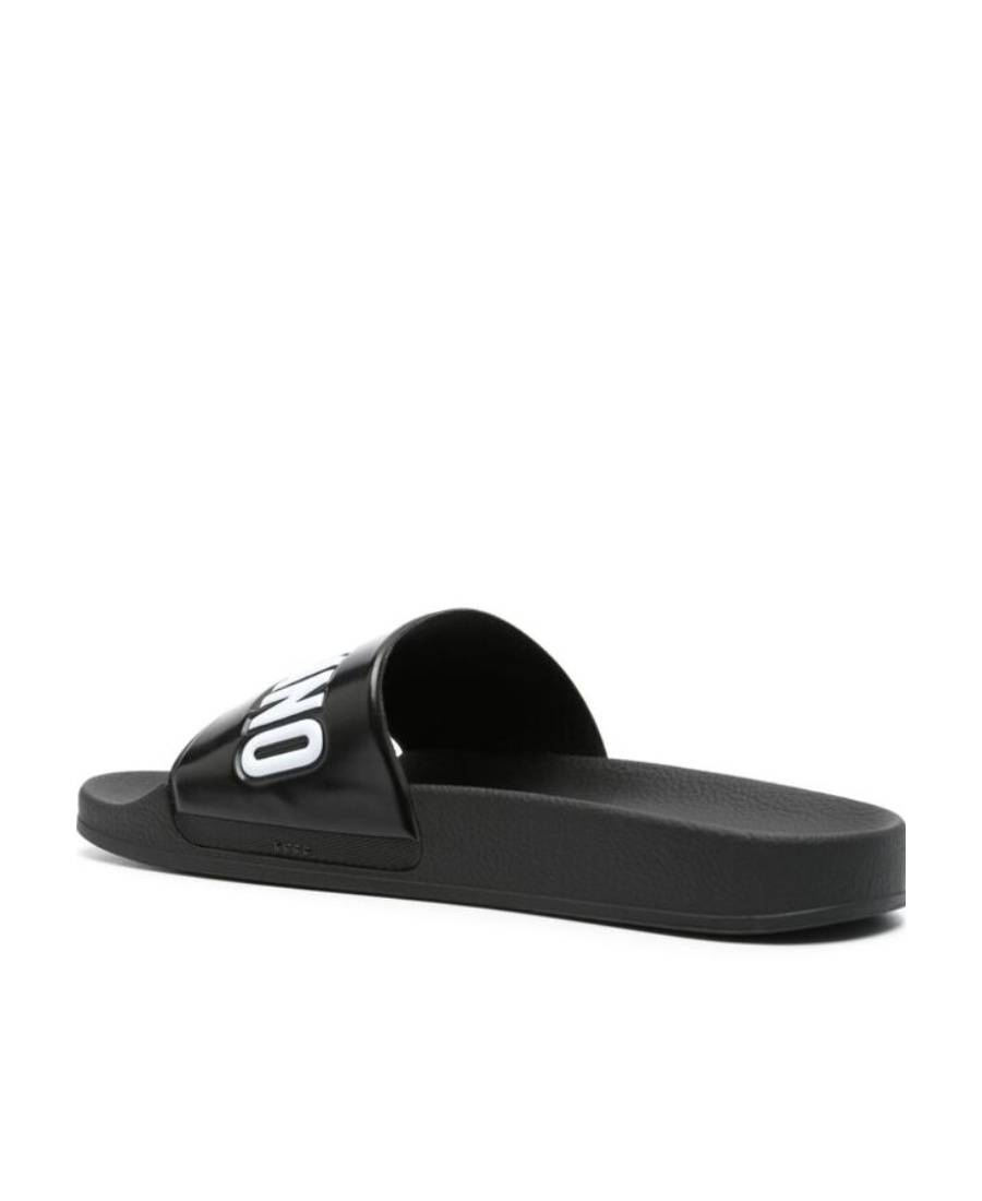 Shop Moschino Logo-embossed Slides In Black