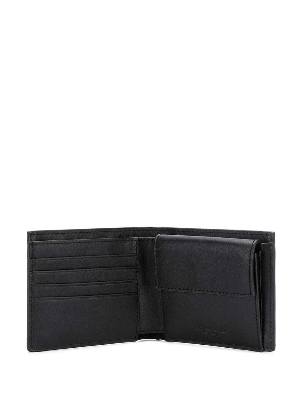 Michael Kors Logo Printed Bi-fold Wallet In Black