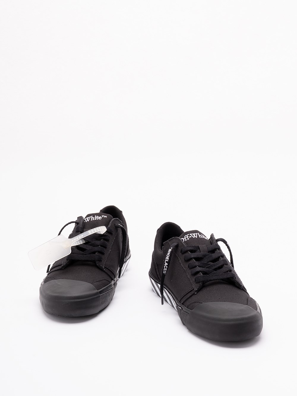 Off-white Low-top Canvas Sneakers Featuring Contrast Stripe In Black