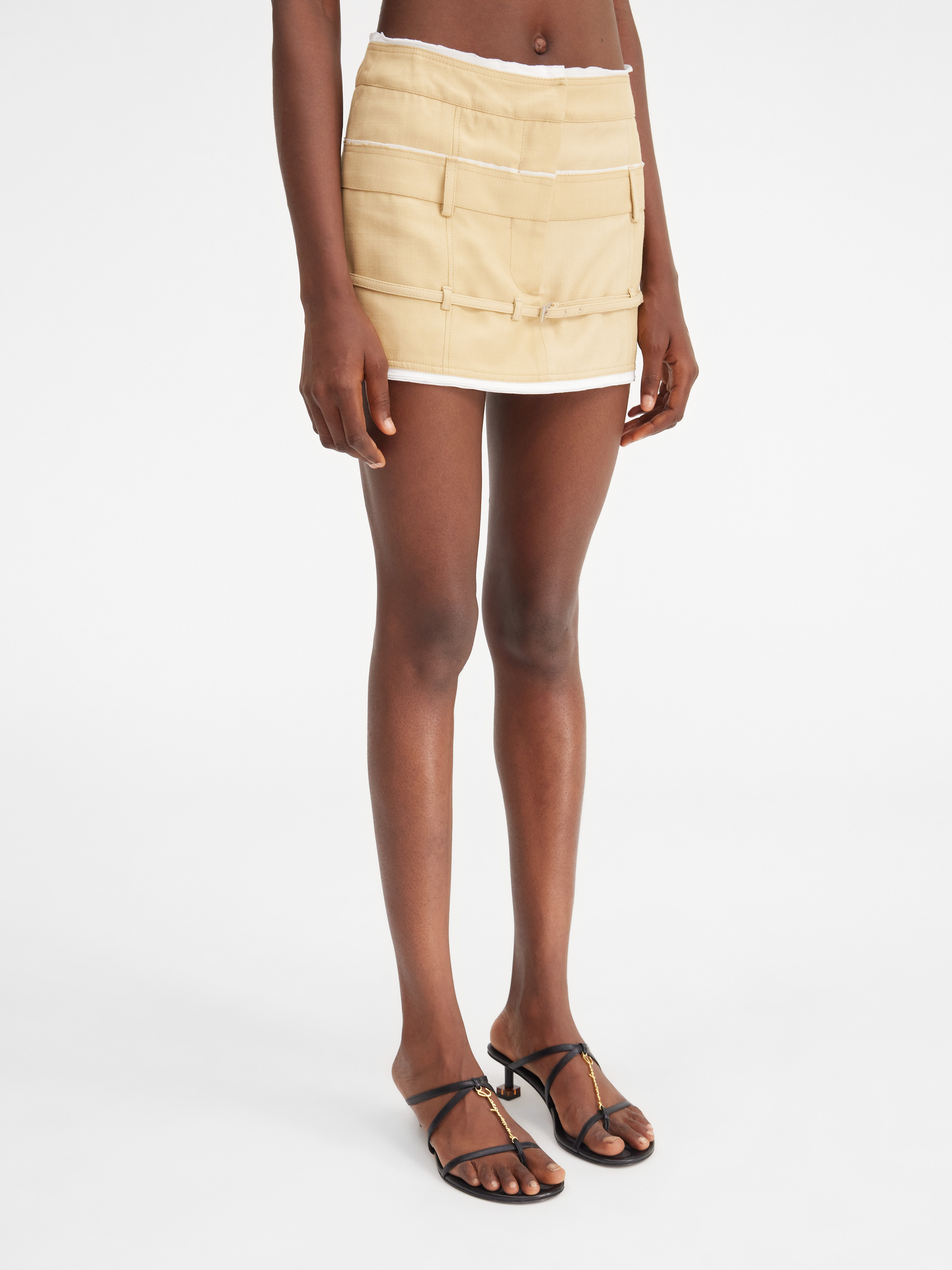 Jacquemus Caraco Buckled Layered Woven Mini Skirt In Nude