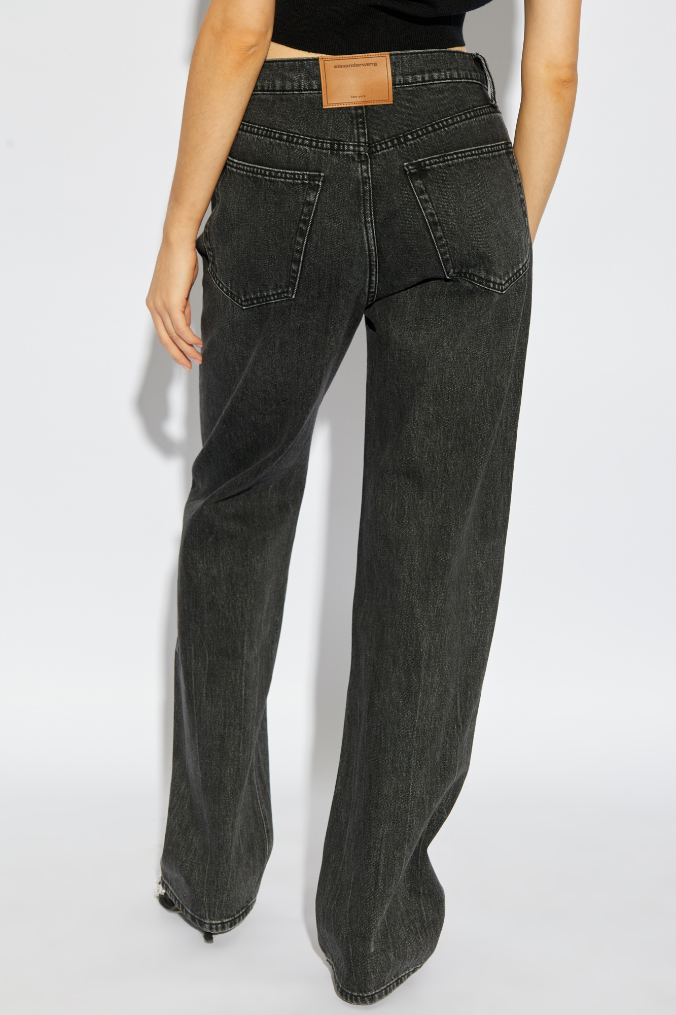 Shop Alexander Wang Cut Out-logo Jeans In Black