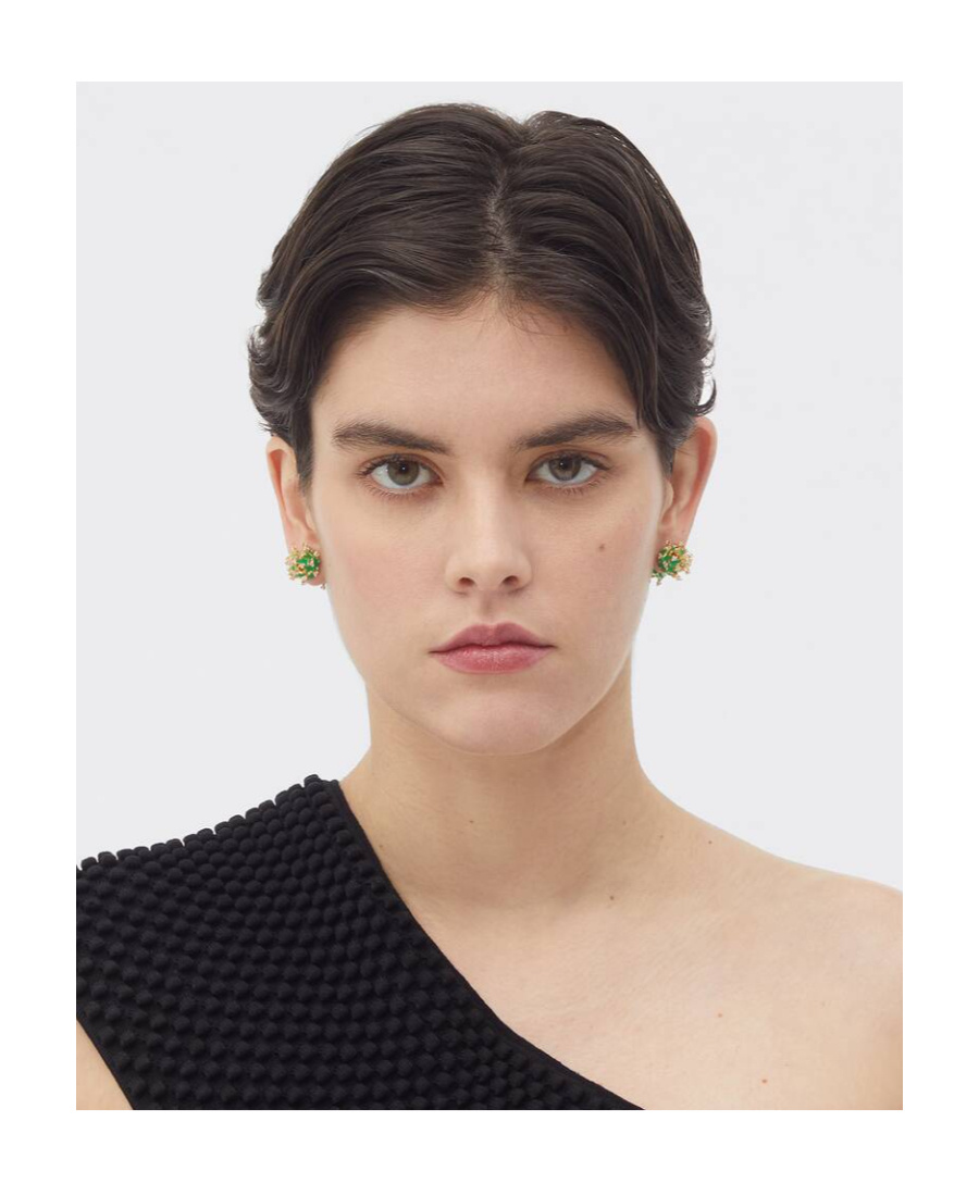 BOTTEGA VENETA WEARING EARRINGS ON TOP OF THE LOGO