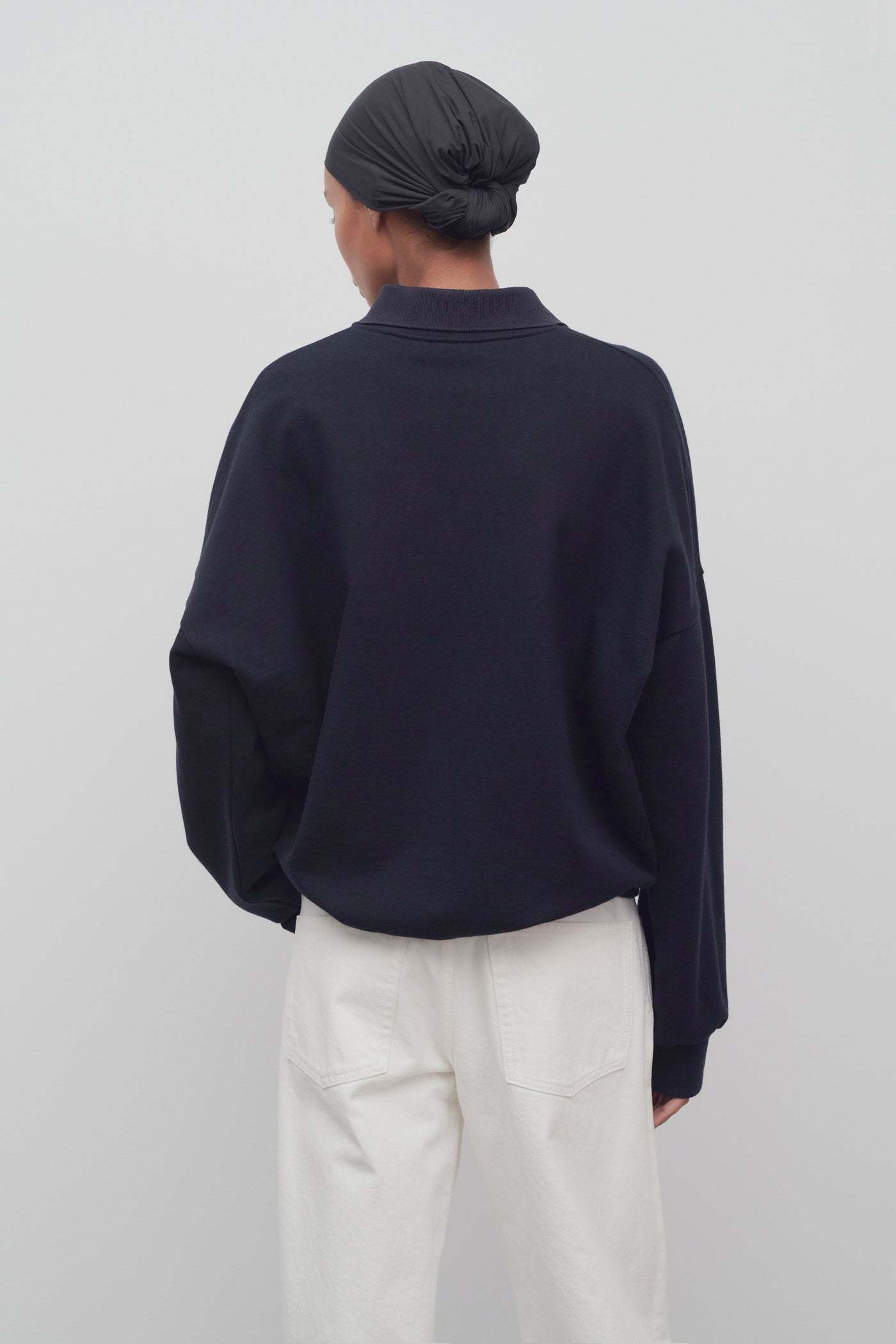 The Row Long-sleeved Polo Jumper In Black