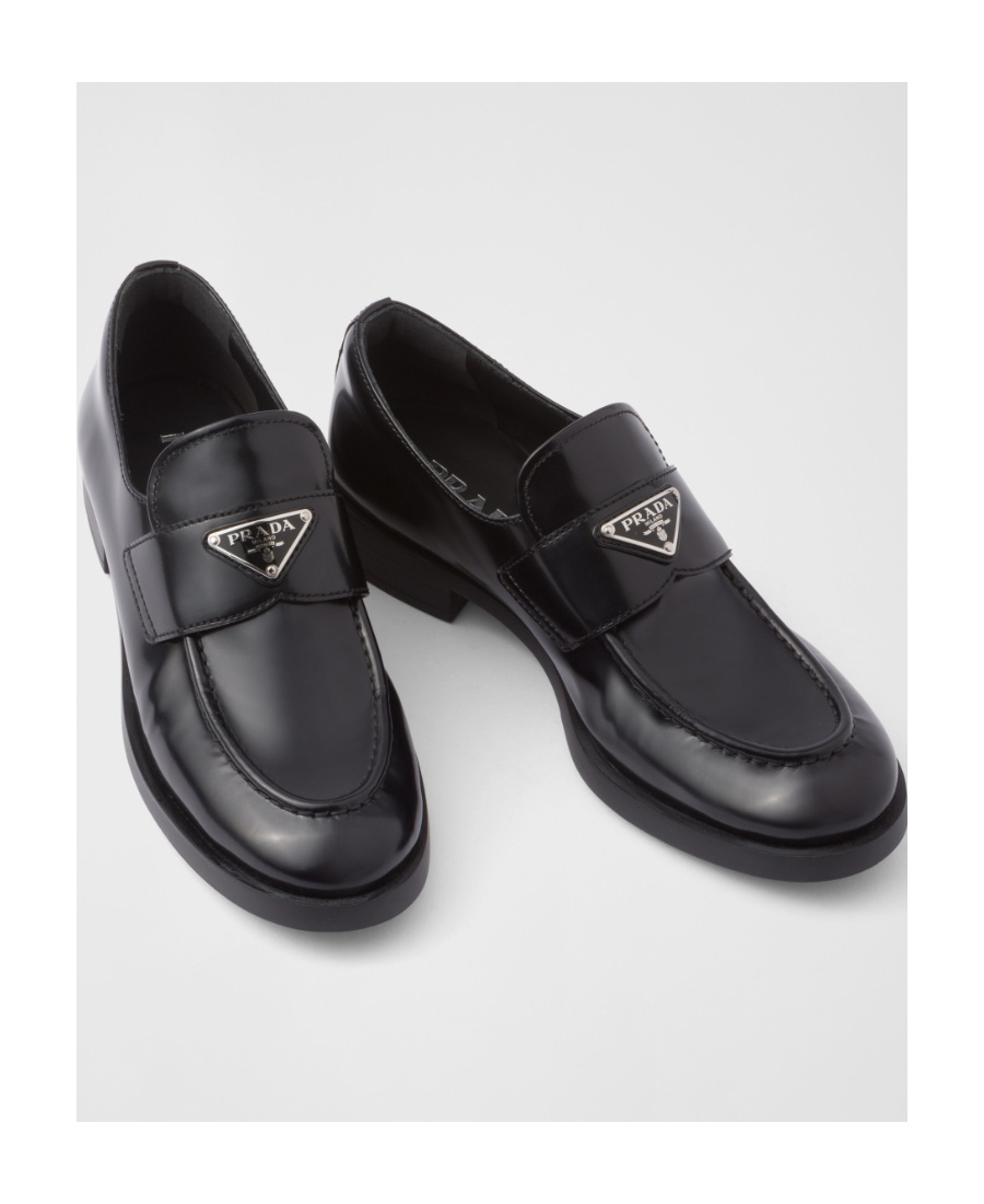 Prada Logo Plaque Almond-toe Loafers In Black