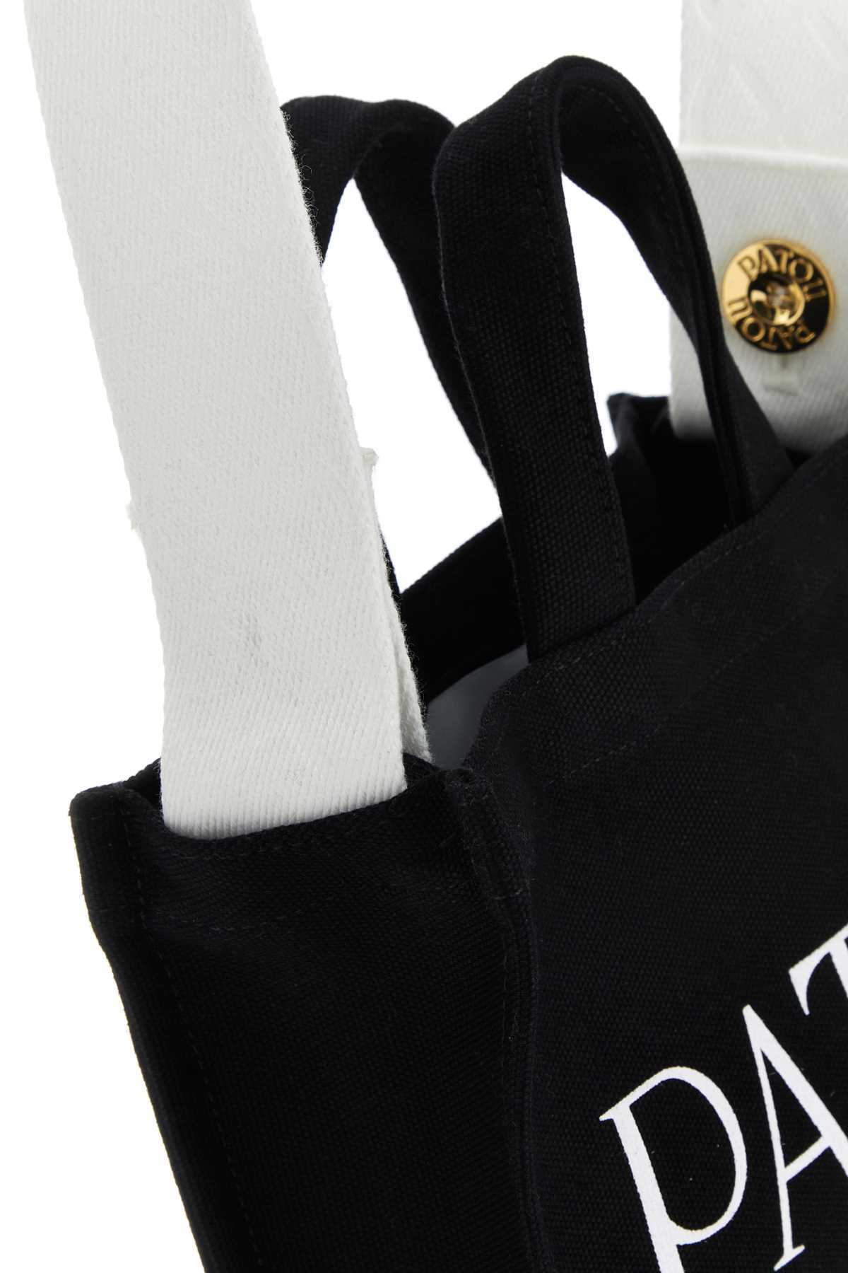 Patou Small Logo-printed Top Handle Bag In Black