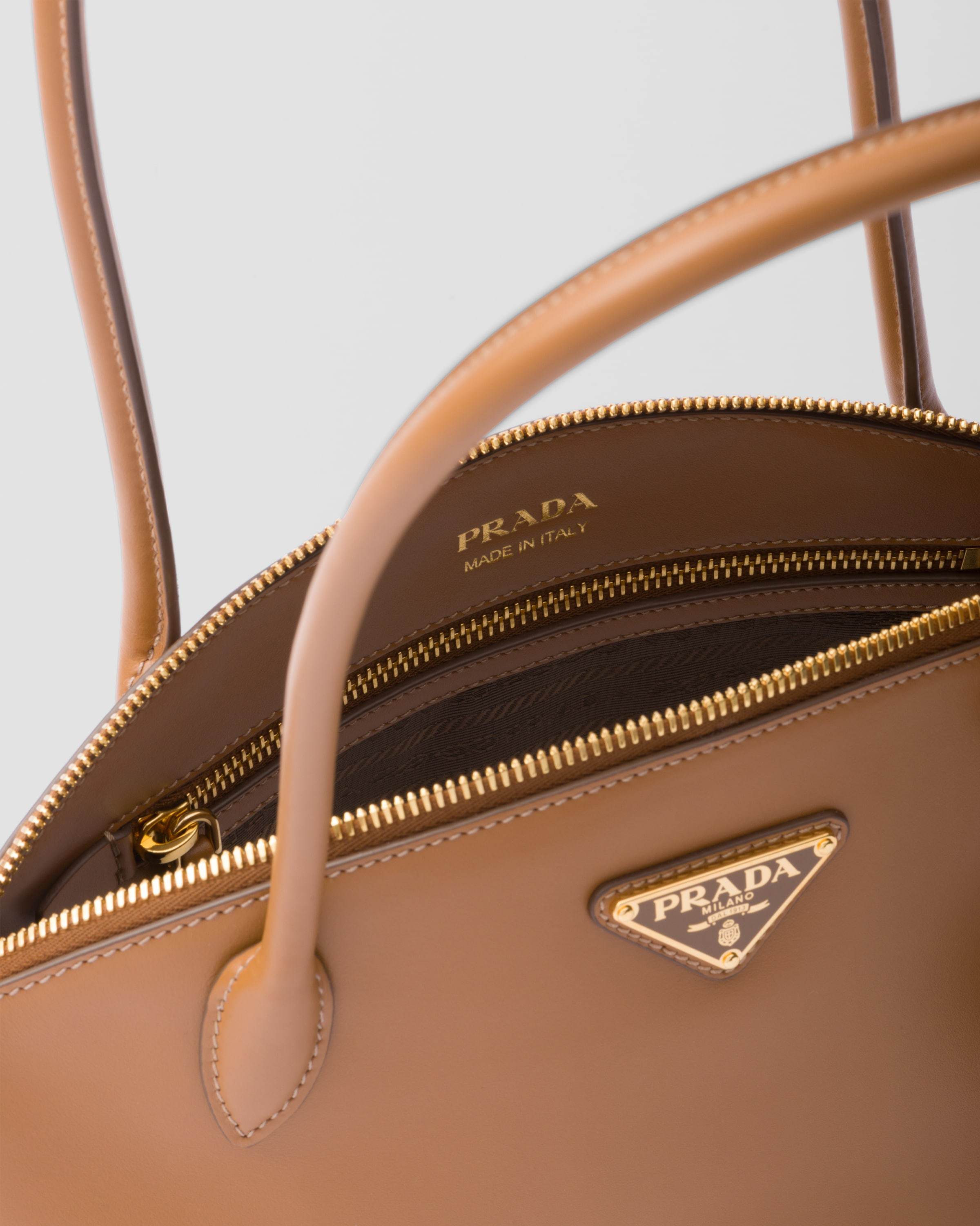 Prada Re-nylon And Leather Medium Top-handle Bag With Padlock In Brown