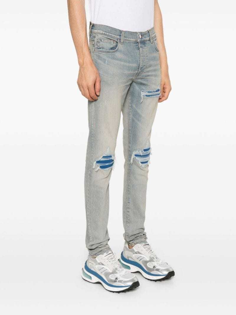 Amiri Mx1 Skinny-fit Panelled Distressed Jeans In Gray