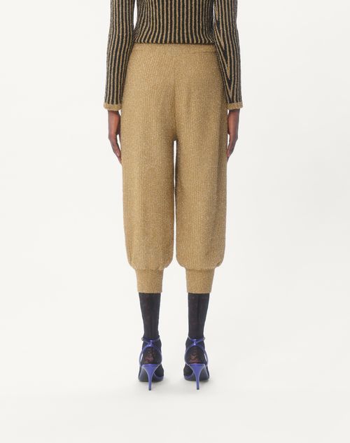 Shop Valentino Lurex Knit Trousers In Golden