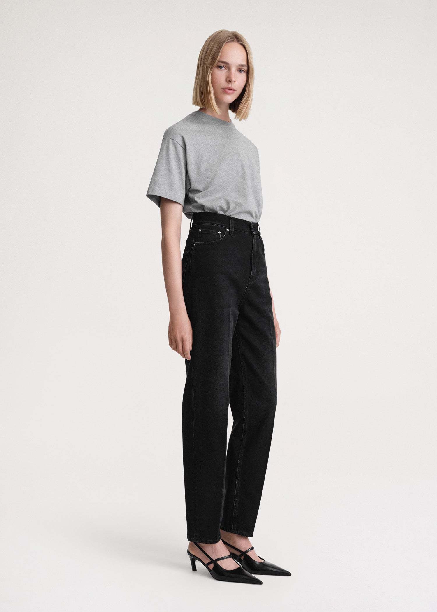 Totême Faded-effect Tapered-leg Jeans In Black