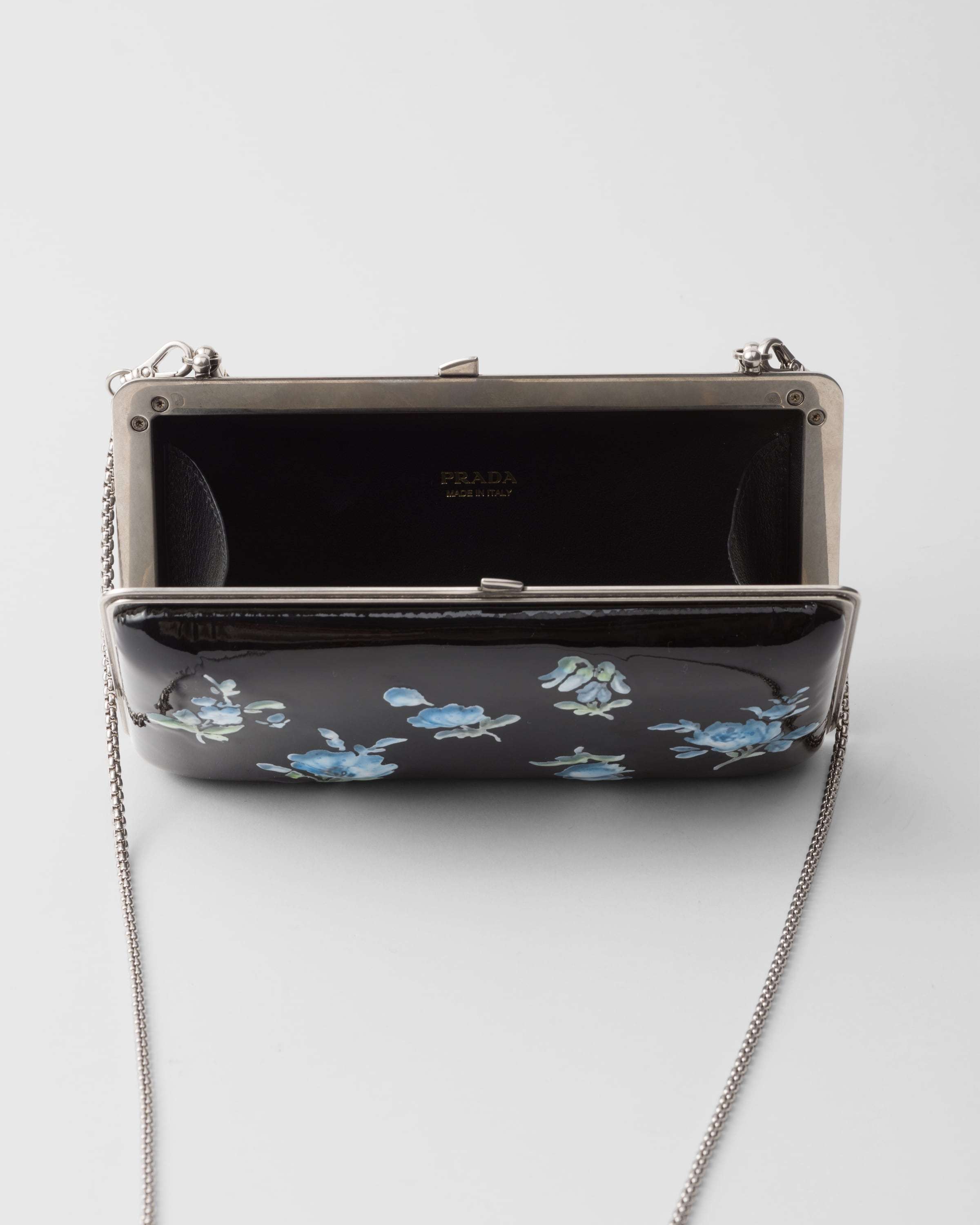 Prada Floral-printed Patent Leather Clutch In Black