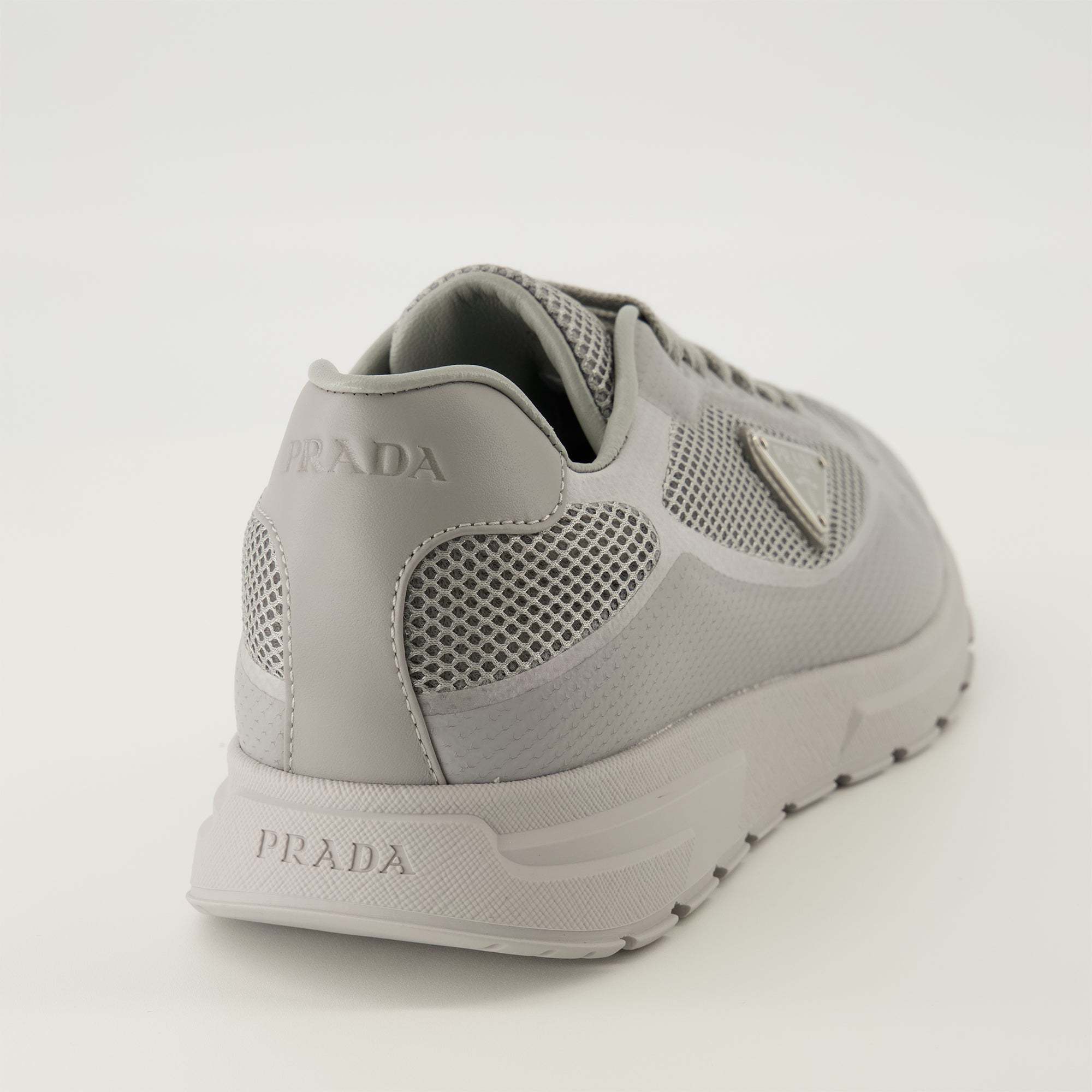 Prada Triangle-logo Lace-up Sneakers In Gray