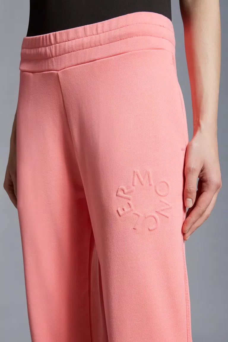 Shop Moncler Embossed Logo Trackpants In Pink